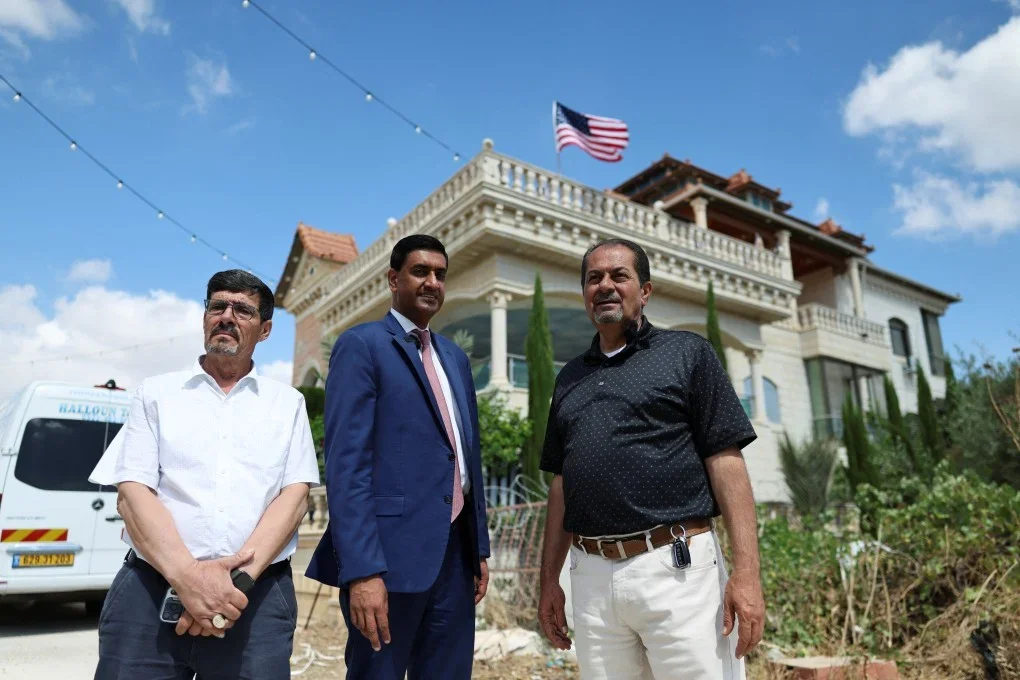 U.S. Representative Ro Khanna (D-CA) with Palestinian residents of Turmus Ayya near Ramallah, West Bank, in front of a large private mansion. Photo Credit: Reuters.