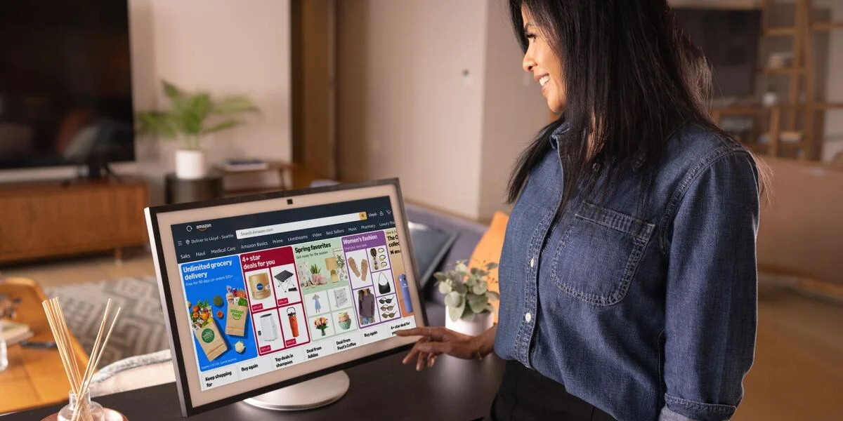 Amazon Echo Show device displaying the new visual shopping interface with product listings and reviews.