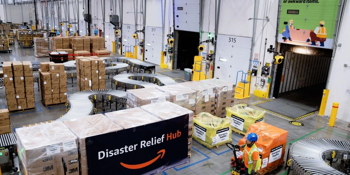 Amazon employees and relief partners preparing emergency supplies for wildfire victims in Spokane.