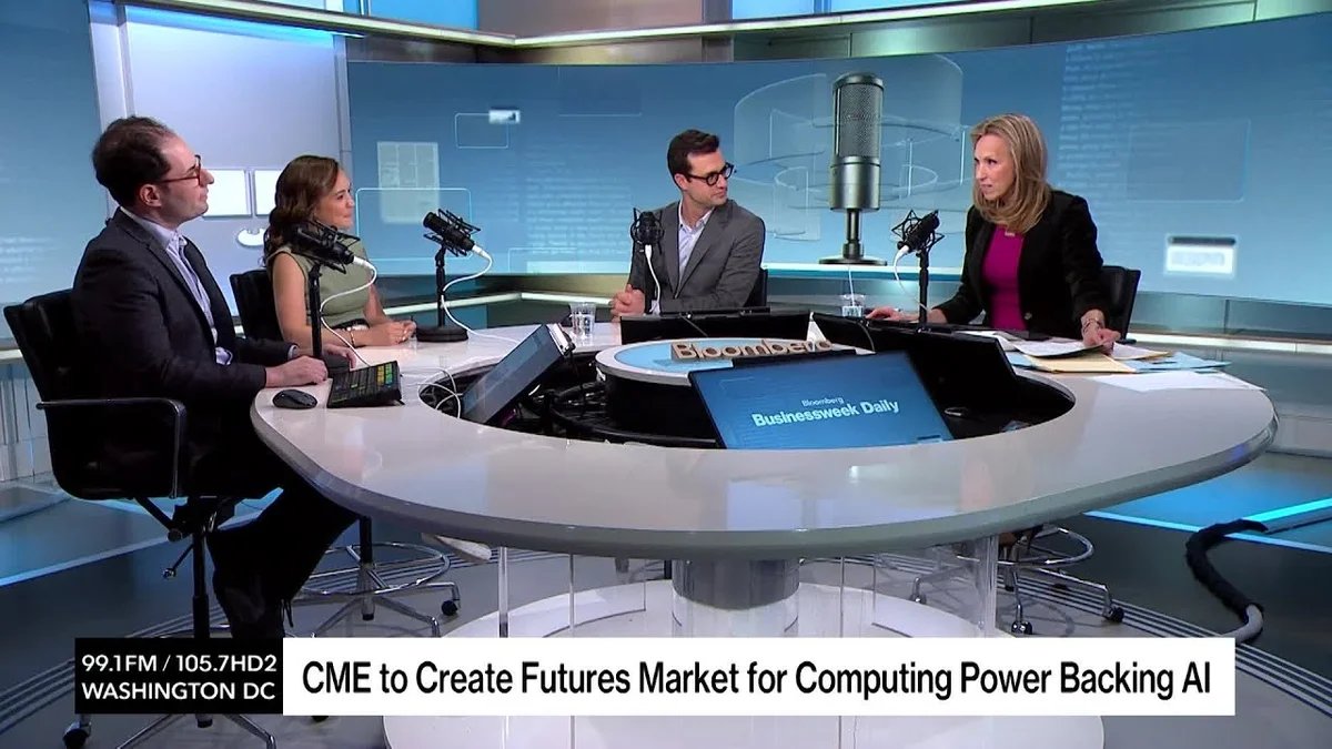 Four people sitting around a table in a broadcast studio, discussing AI computing power futures.