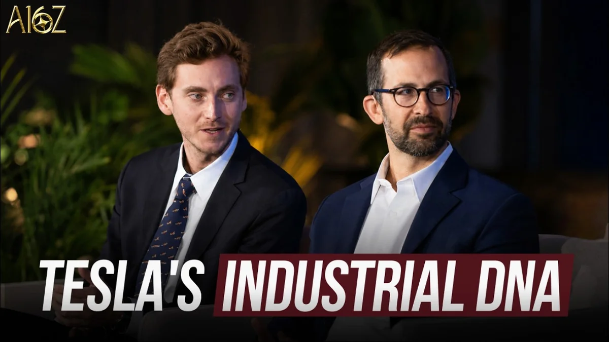 Three people sitting on chairs on a stage, discussing industry and AI.