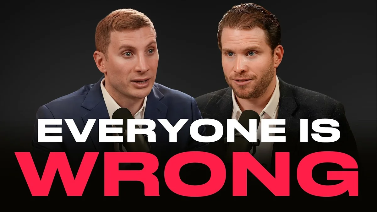 Two men in suits discussing technology and the economy in a podcast setting.