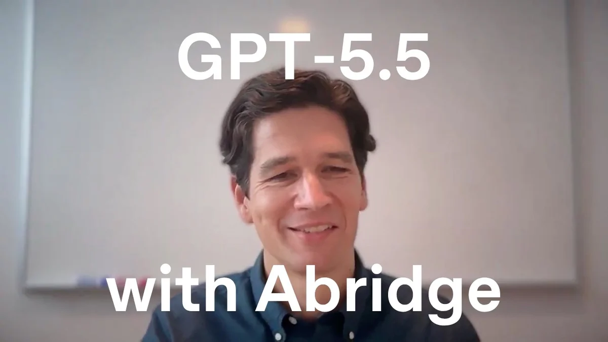 Man in a dark blue shirt speaking, with text overlay 'Built With GPT-5.5'