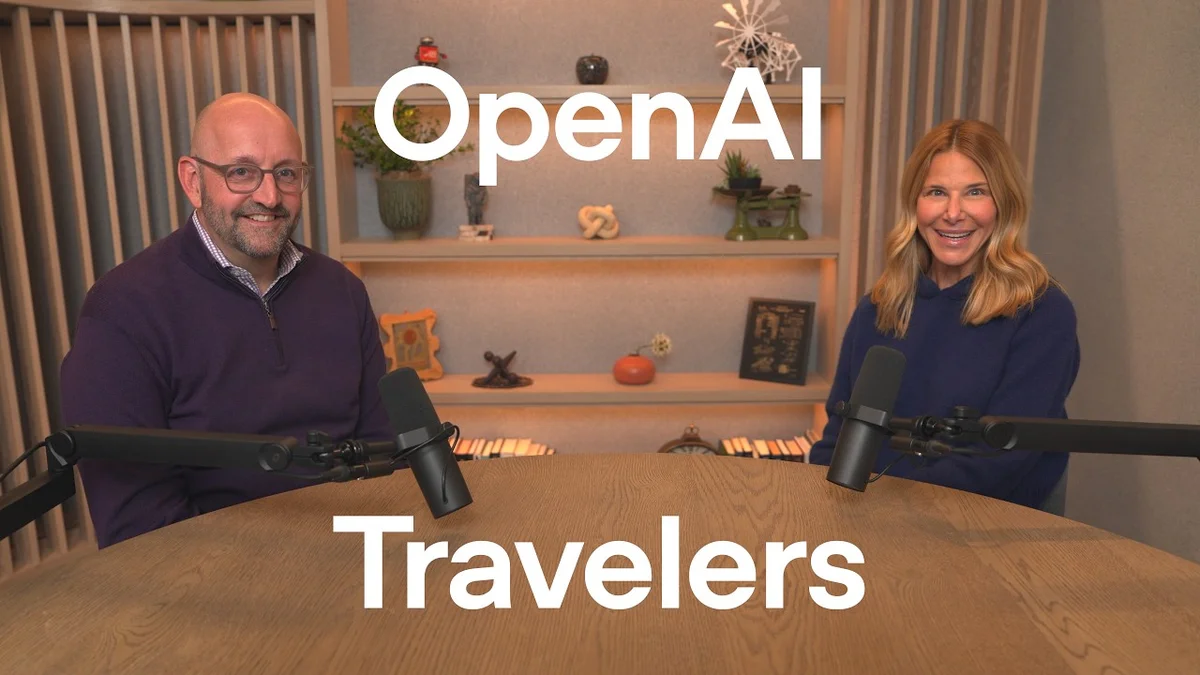 Two people sitting at a table with microphones, with 'OpenAI' and 'Travelers' displayed.
