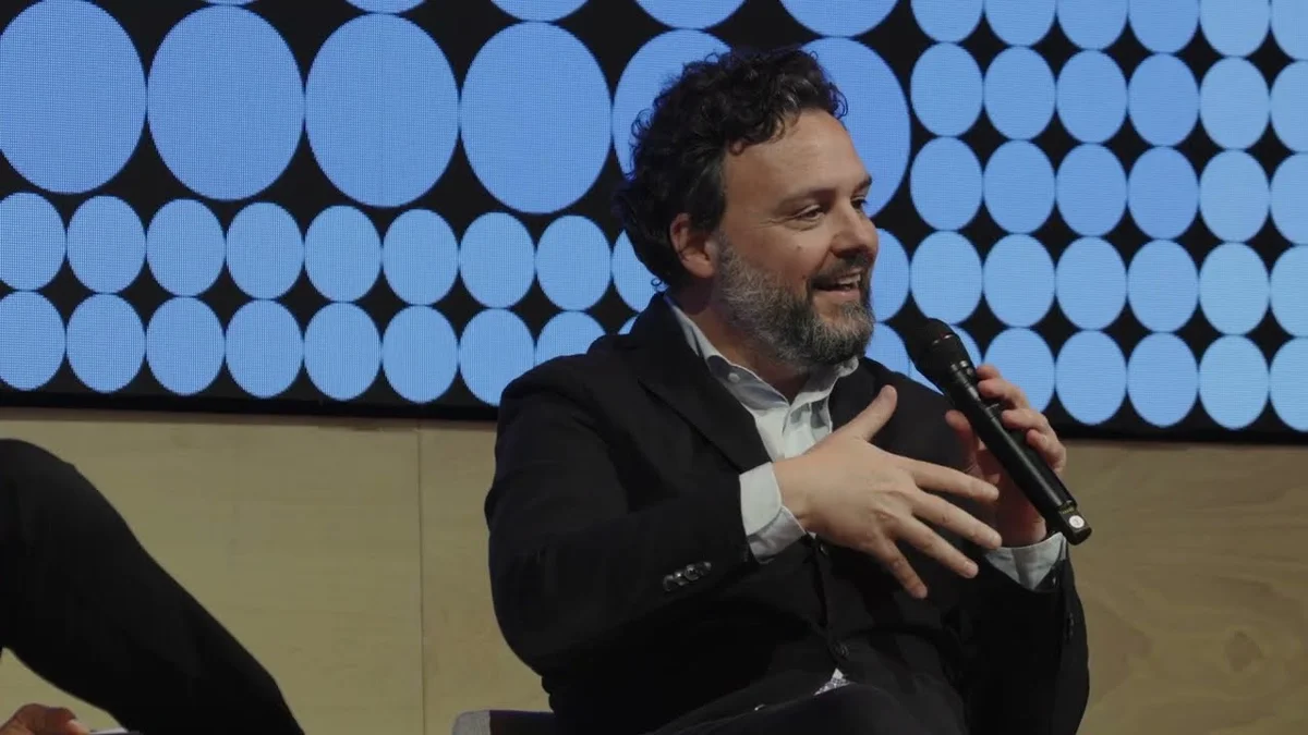 Folley Ogundele of OpenAI and Maurizio Poletto of Erste Group speaking on stage.