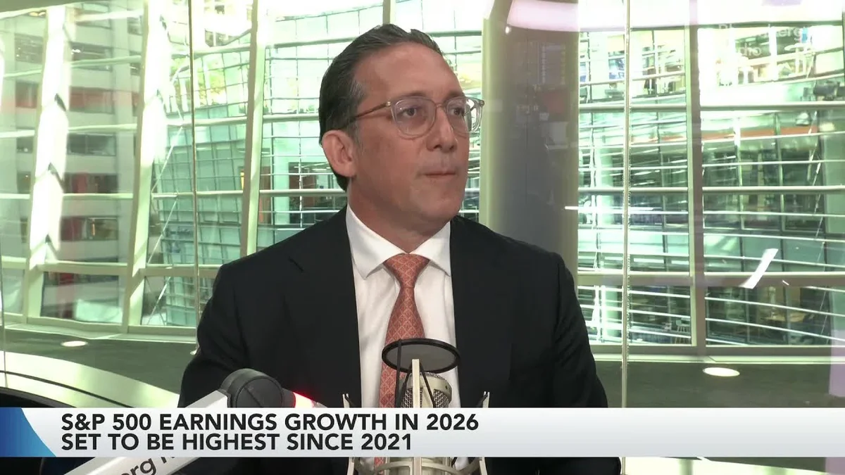 Two men in suits on a video call discussing market trends, with stock market data displayed.