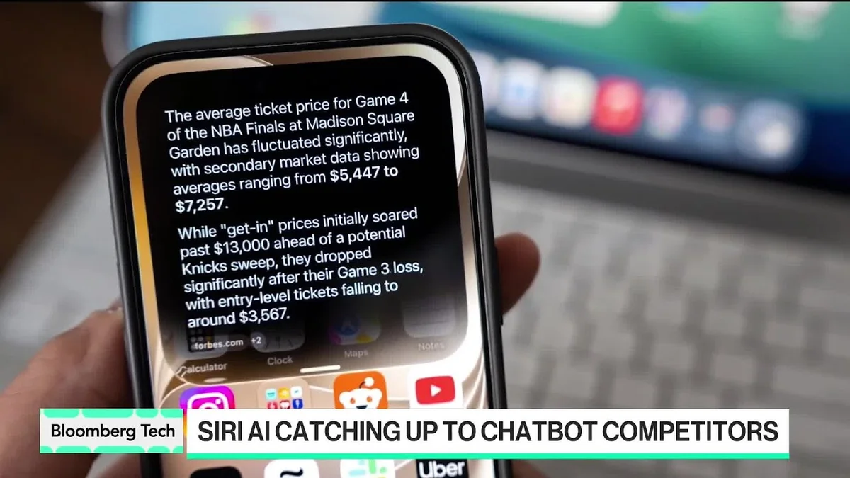 Split screen showing a Bloomberg Tech reporter and Mark Gurman discussing Siri AI catching up to chatbot competitors.
