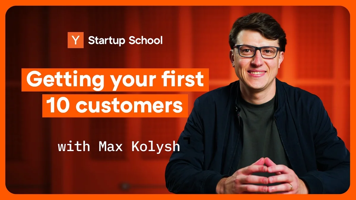 Max Kolysh speaking at a table for Startup School video.