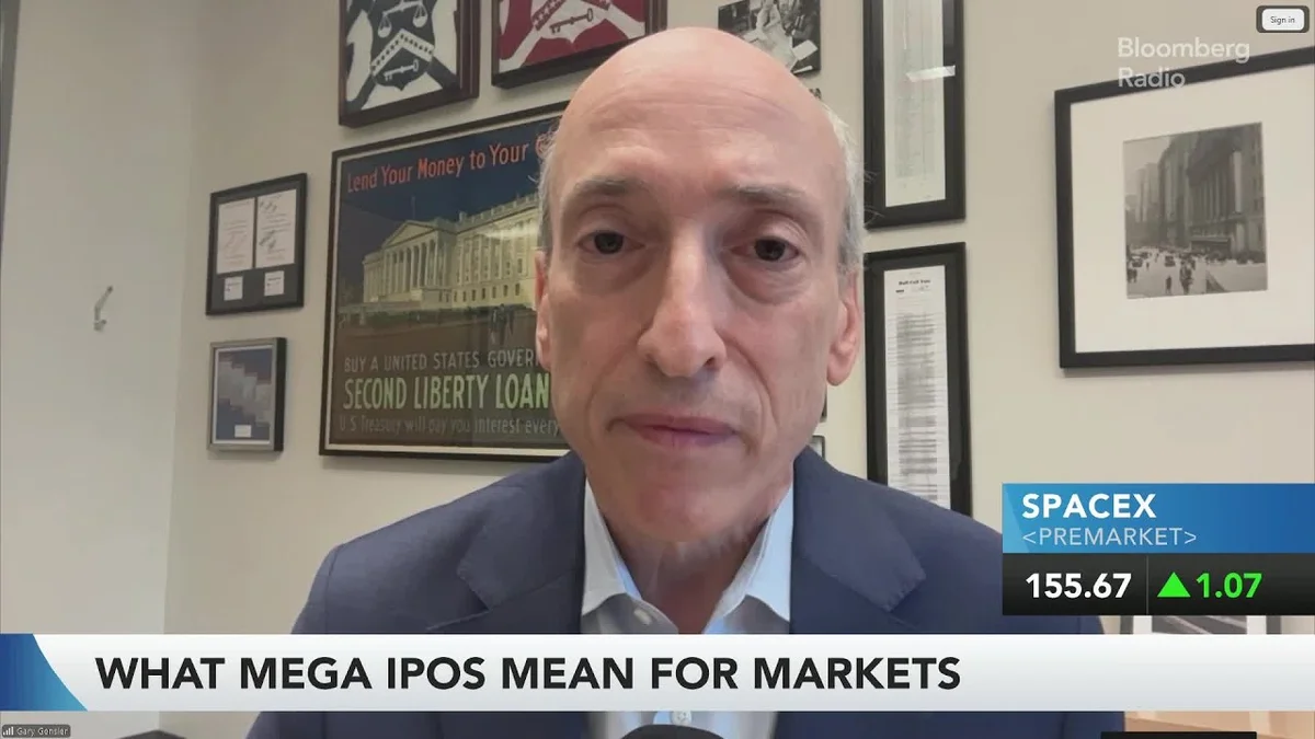 Gary Gensler speaking via video call, with a split screen showing the SpaceX logo and the OpenAI logo.