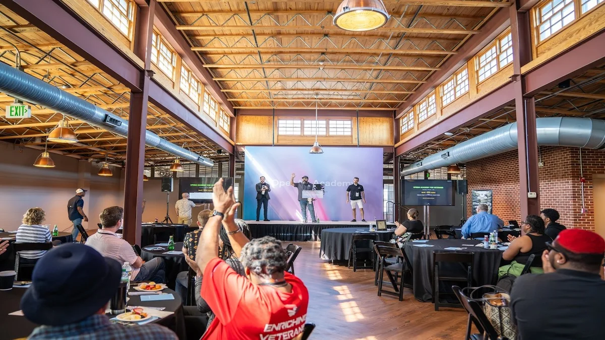 Group of veterans and trainers at an OpenAI Academy x Veterans Forge event.