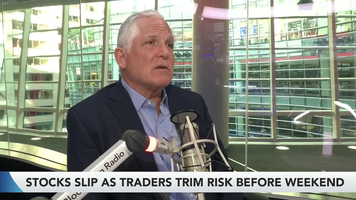George Noble speaking at a Bloomberg Radio desk.