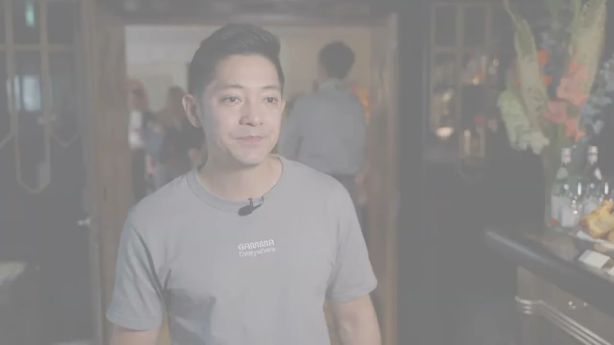 Grant Lee, Co-Founder & CEO of Gamma, speaking at an event with OpenAI and Gamma branding visible.