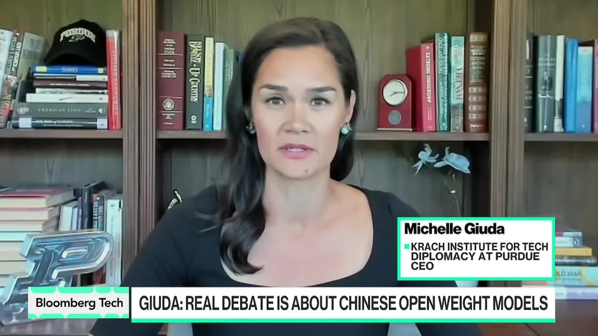 Michelle Giuda speaking in a video interview about AI competition between the US and China.