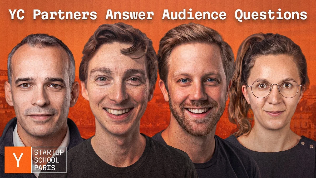 Panelists speaking on stage at a Y Combinator Startup School event.