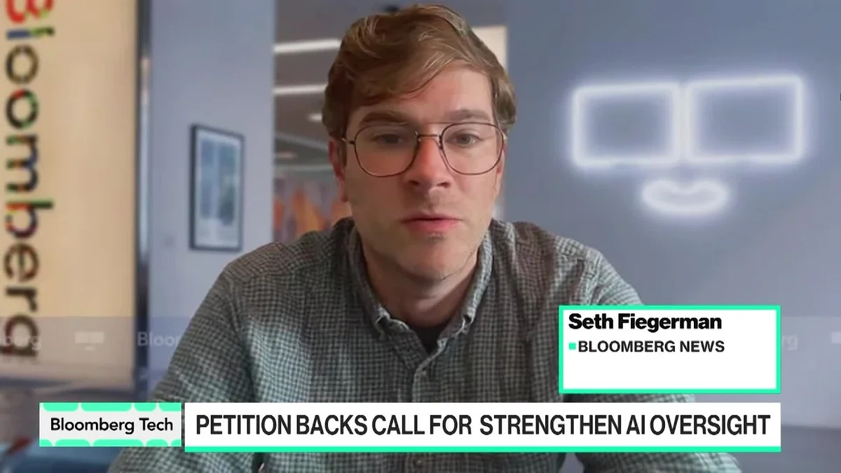 Bloomberg Tech reporter speaking on camera with a graphic overlay about AI leaders calling for pacing tech growth.