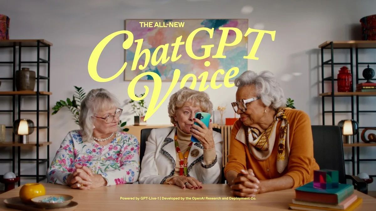An elderly woman smiling while holding a smartphone displaying the ChatGPT interface.