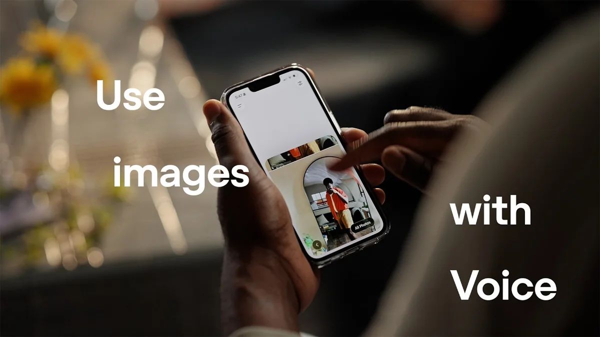 Person holding a smartphone showing the ChatGPT interface with an image upload option.